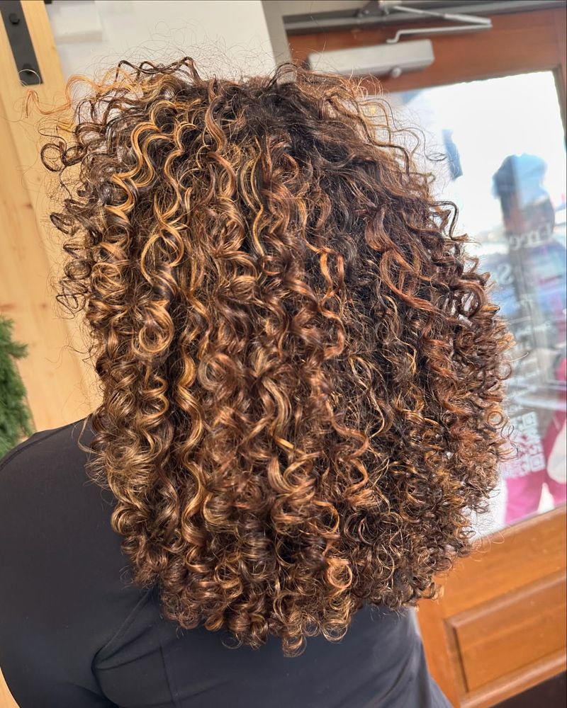 Vibrant Caramel Highlights with Curls